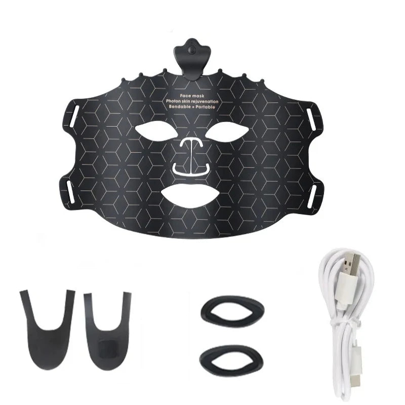 Black face mask with attachments and USB cable on a white background