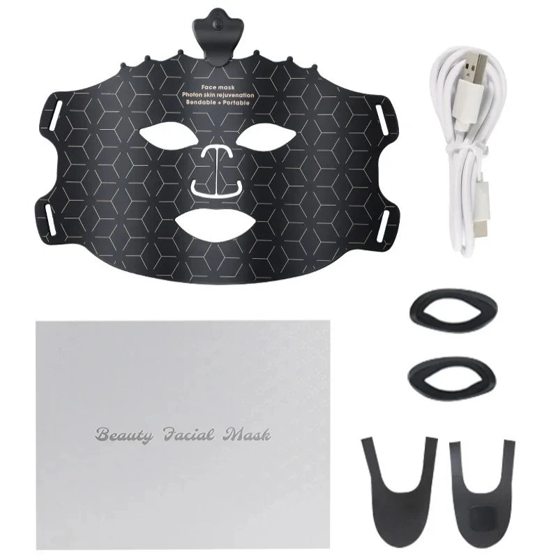 Beauty facial mask with attachments and USB cable on a white background